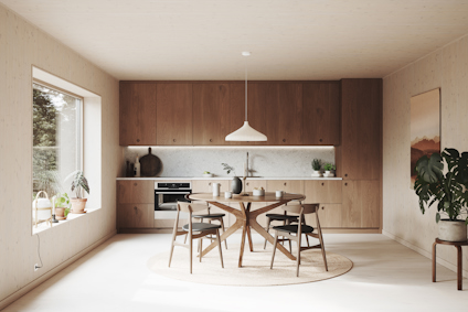 Modernt kök med trämöbler, ett runt bord, sex stolar och växter, stora fönster med utsikt mot träd.