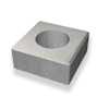 Grått, fyrkantigt betongelement med ett runt hål i mitten.