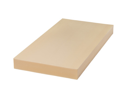 Rektangulär skiva av beige cellplast sedd snett uppifrån mot vit bakgrund.